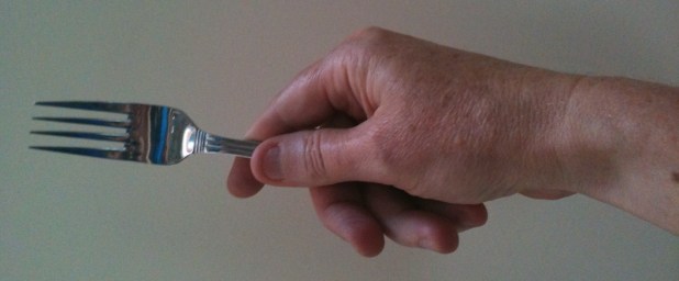 Hand holding fork